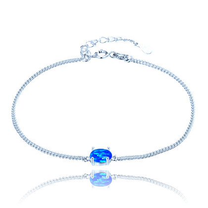 MINET Srebrna bransoletka z niebieskim opalem